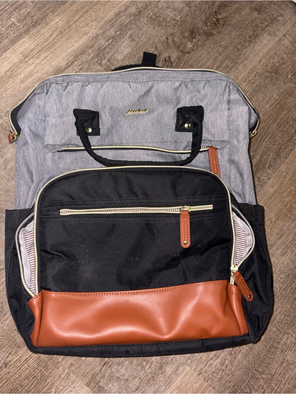 Two-Tone Black and Gray Backpack with Brown Trim